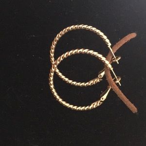Gold toned twisted loops